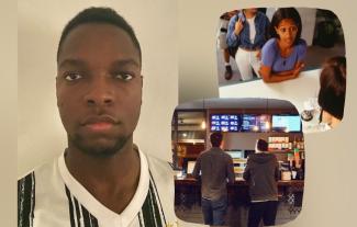 A man looking at the camera, beside a woman at a till and the backs of two men at a fast food counter
