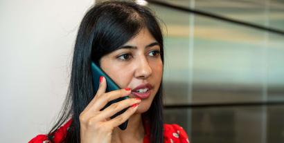 A woman speaking into a mobile phone