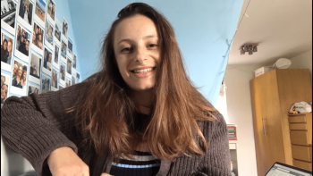 A woman looking at the camera and smiling