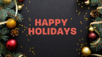 Decorated Christmas tree branches surrounding text saying 'Happy holidays'