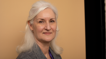 A woman looking at the camera and smiling