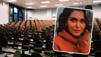 A woman smiling, with an empty lecture theatre as a backdrop