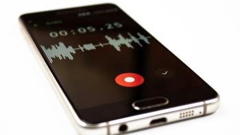 A smartphone, displaying soundwaves on a recording app