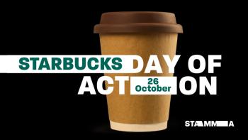 A cup from a coffee shop with the words 'Starbucks Day of Action' surrounding it