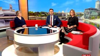 TV presenters on a sofa interviewing a woman