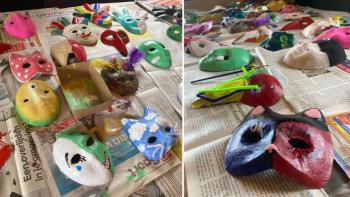 Lots of brightly painted masks on a table