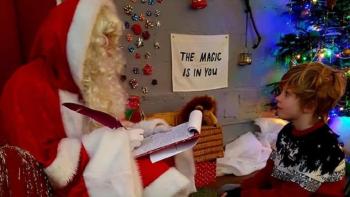 A young boy meeting Father Christmas