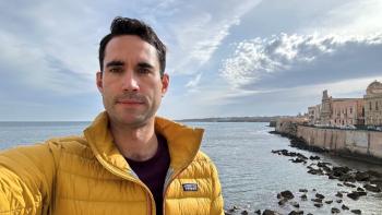 A man by the coast taking a selfie