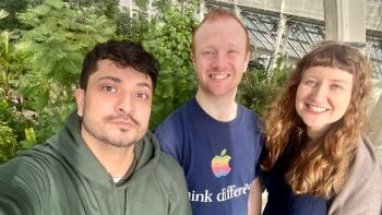 Three people smiling for the camera