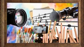 A mixture of creative things, including paintbrushes, coloured pencils, a musical stave, a camera, a notepad, a microphone and a mobile phone