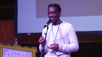 A man speaking into a microphone
