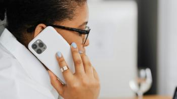 A woman speaking into a mobile phone