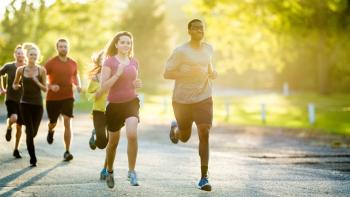 A group of people running in a park