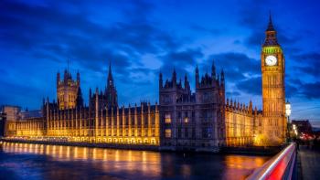 The Houses of Parliament against a cloudy sky at dusk