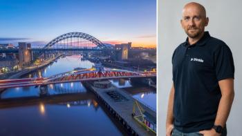 The bridge over the River Tyne at sunset, next to a man smiling