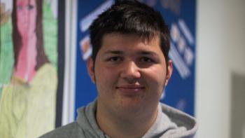 A young man smiling
