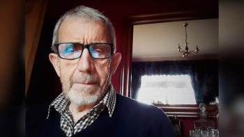 A man with a serious expression on his face