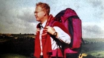 A man out on a hike, wearing a rucksack