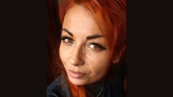 A woman smiling