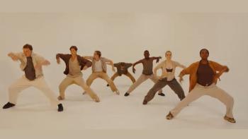 A troupe of dancers in a synchronised move