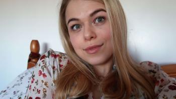 A  young woman smiling