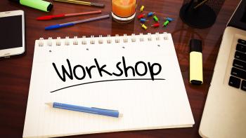 A writing pad with the word 'Workshop' on it