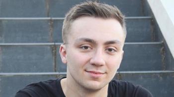 A young man smiling for the camera