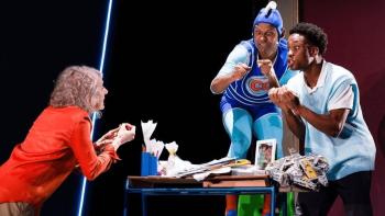Three actors performing in a play