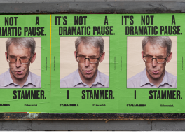 Three billboard posters featuring a man's face with the text 'It's not a dramatic pause. I stammer' above and below them