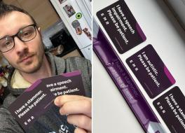 A man holding two cards