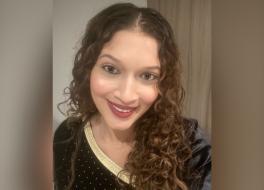 A woman smiling