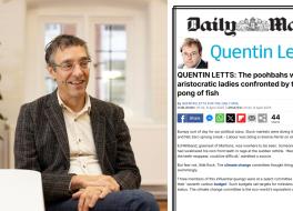 A man sitting down, smiling, next to an insert of a newspaper article