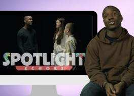A man sitting on a stool, next to a screen showing the same man speaking with a woman and a boy. On the screen is the title 'Spotlight Echoes'