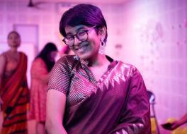 A woman in traditional Indian dress, smiling