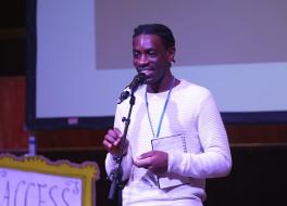 A man speaking into a microphone