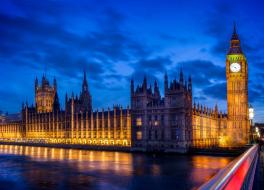 The Houses of Parliament against a cloudy sky at dusk