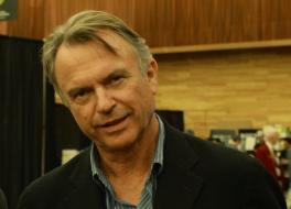 The actor Sam Neill smiling