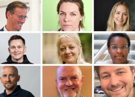 Nine smiling faces, five men and four women