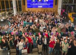 A crowd of people waving