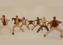 A troupe of dancers in a synchronised move