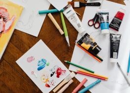 Arts and craft materials, including paper, paint, pencils, scissors and paintbrushes