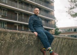 A man sitting on a wall 