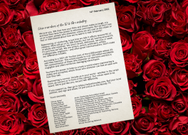 A typed letter with a background of roses
