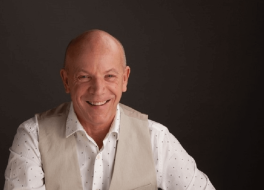 A man looking at the camera and smiling