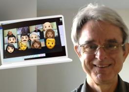 A man smiling, next to a laptop displaying a group video call in progress