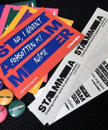 A selection of colourful postcards, stickers and badges 
