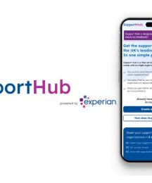 A mobile phone showing text from a webpage, with a logo next to it saying 'Support Hub powered by Experian'