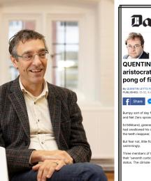 A man sitting down, smiling, next to an insert of a newspaper article
