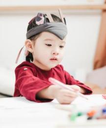 A young girl drawing