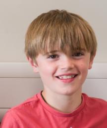 A young boy smiling